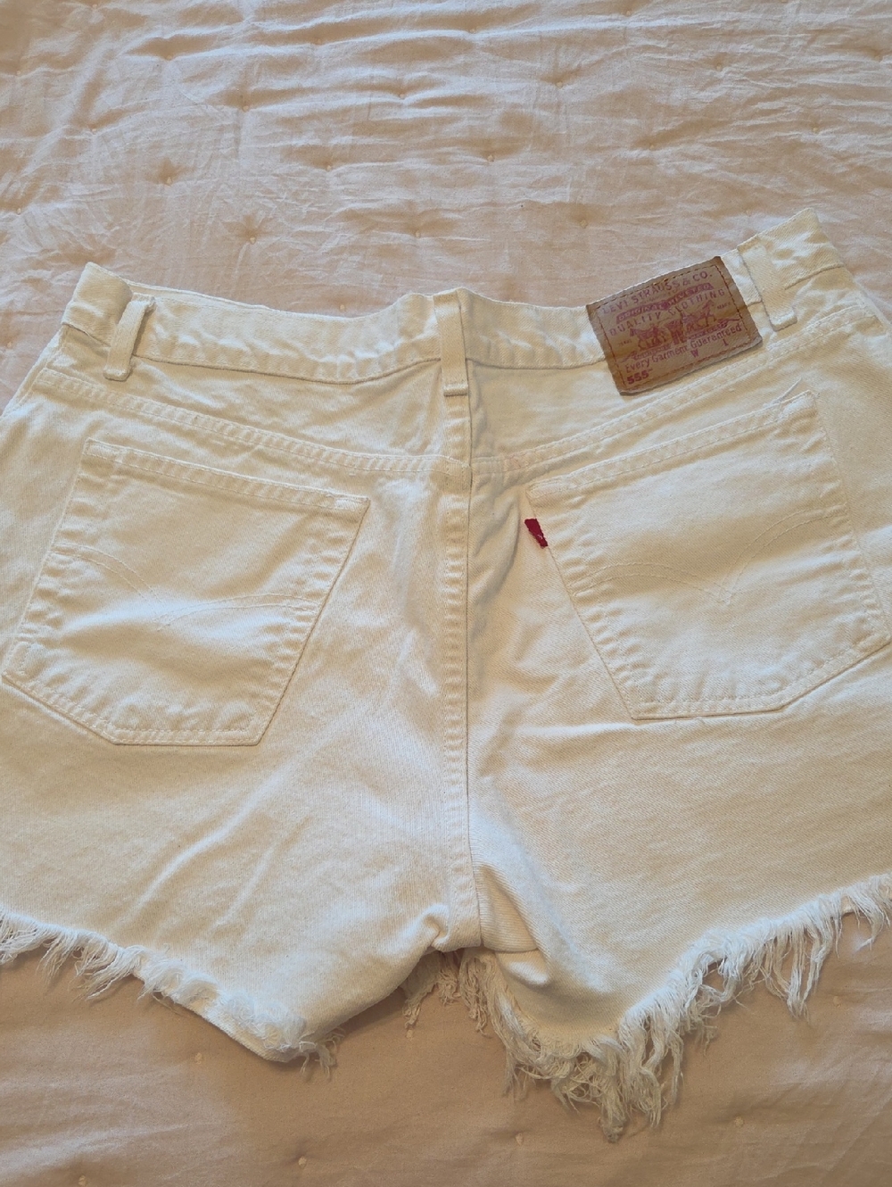 Levi's White Cutoff Denim Shorts with Frayed Hem